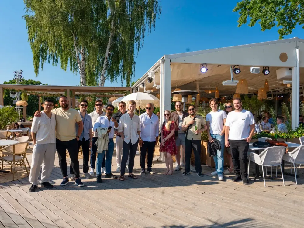 The baemingo team standing outside in the sun smiling into the camera