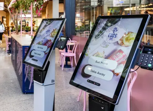 Two express checkout kiosks in a restaurant